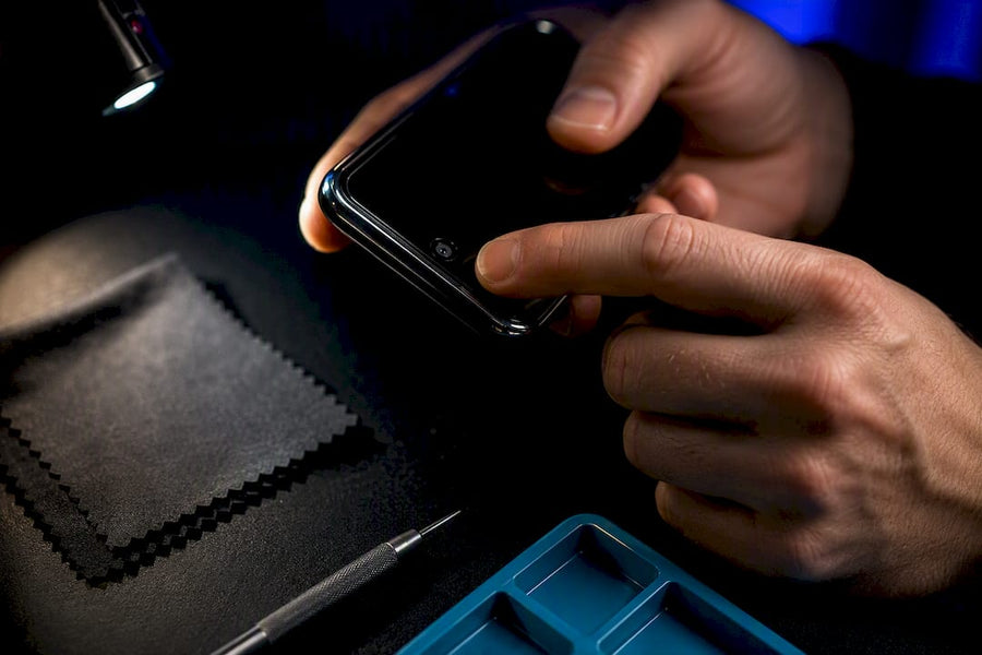 Technician testing an anonymous phone edge