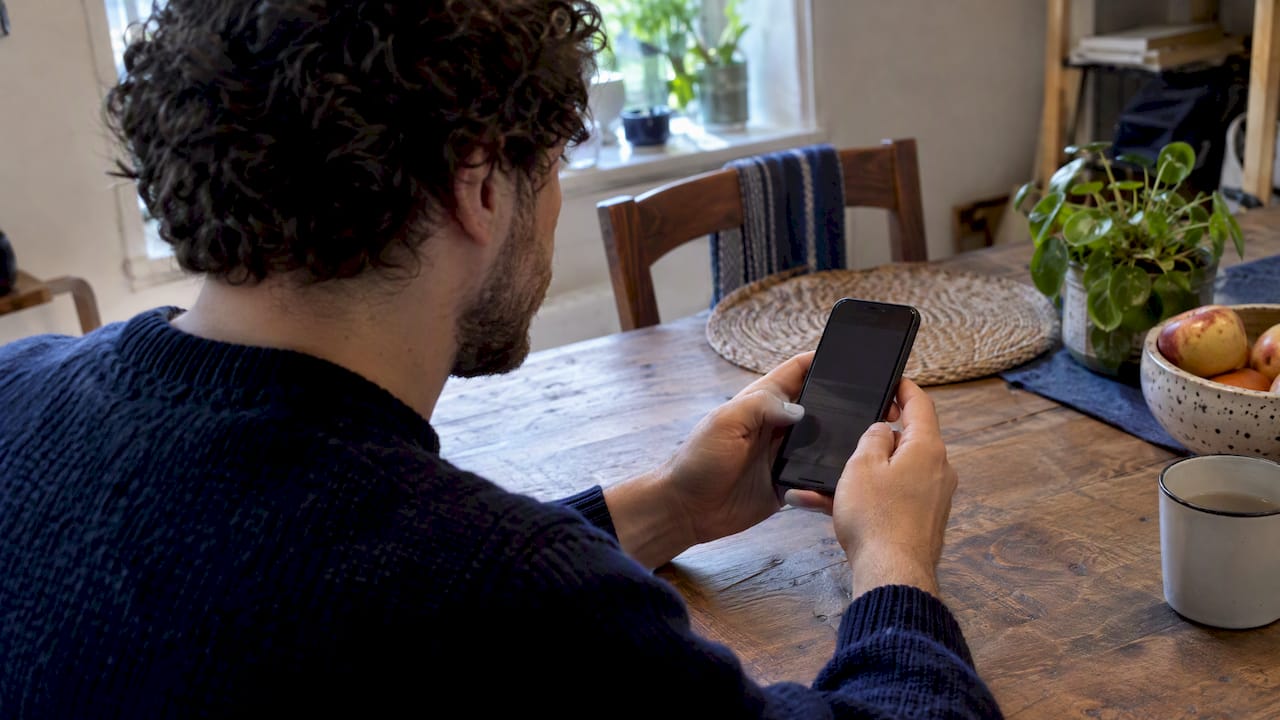 Shopper checking a refurbished phone battery